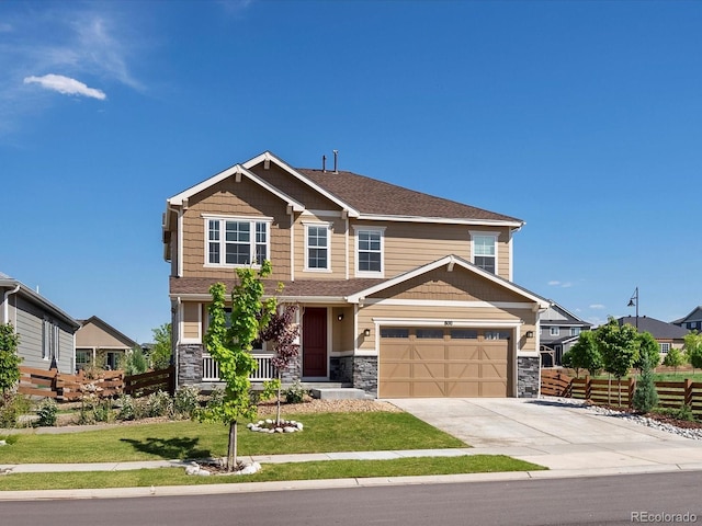 800 Boulder Peak Ave, Erie, CO 80516 - craftsman-style house featuring concrete driveway, stone siding, and a garage