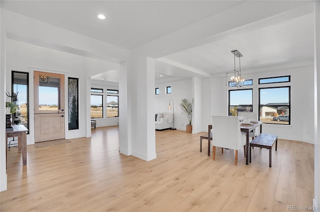 8700 Lost Lake Dr, Franktown, CO 80116 - dining room featuring an inviting chandelier, light wood finished floors, and baseboards