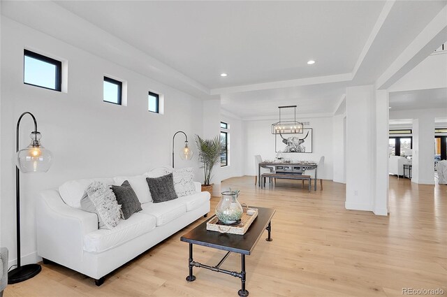 8700 Lost Lake Dr, Franktown, CO 80116 - living area with a wealth of natural light and light wood-style flooring