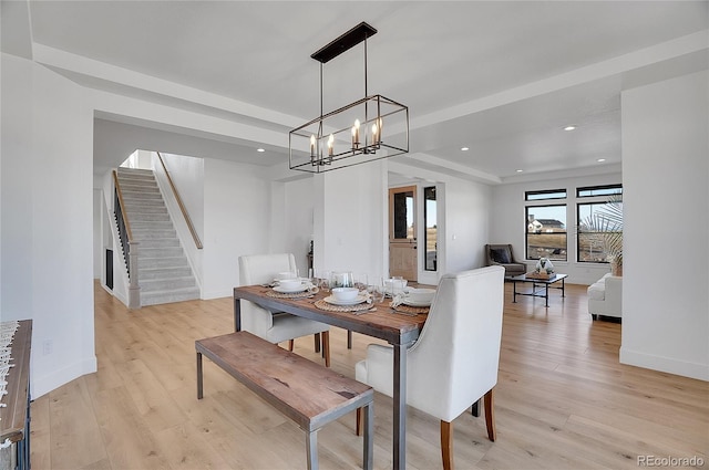 8700 Lost Lake Dr, Franktown, CO 80116 - dining area with recessed lighting, light wood finished floors, stairs, and a notable chandelier