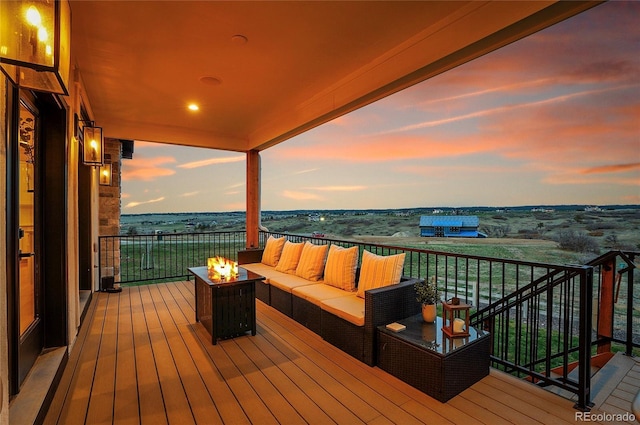 8700 Lost Lake Dr, Franktown, CO 80116 - deck at dusk featuring a water view and an outdoor living space with a fire pit