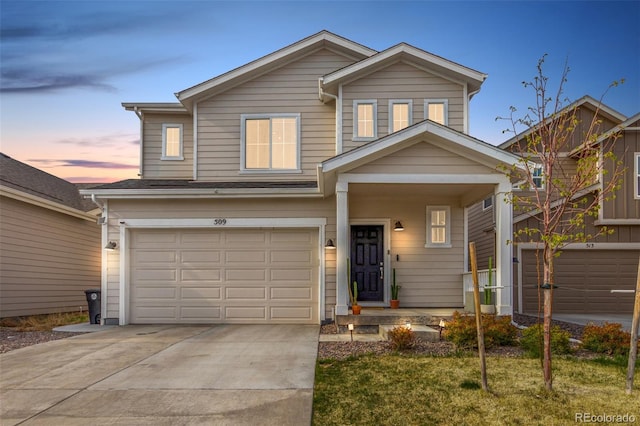 traditional-style home with an attached garage, driveway, and a porch