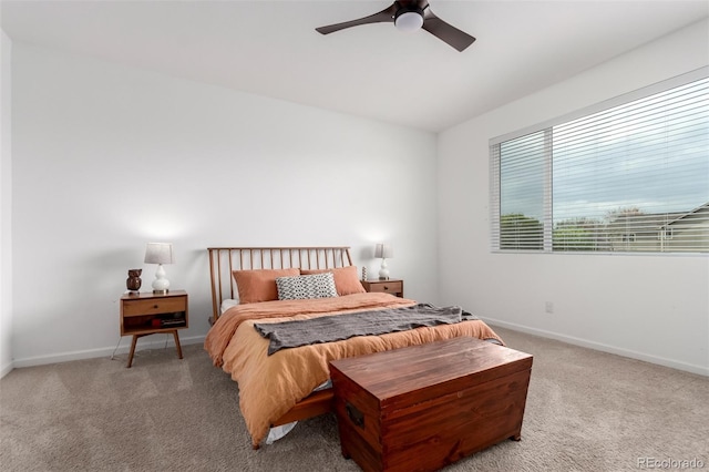 bedroom with carpet floors, baseboards, and a ceiling fan