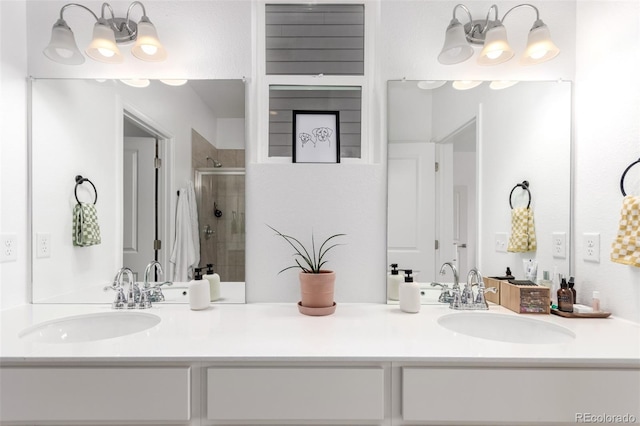 bathroom featuring a shower stall and double vanity