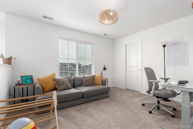 carpeted office featuring baseboards