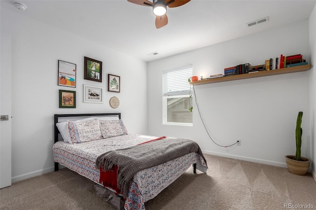 carpeted bedroom featuring baseboards and ceiling fan