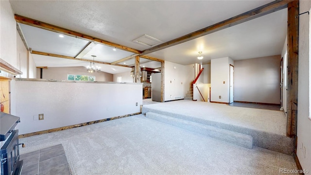 321 Stockton Ct, Gilcrest, CO 80623 - unfurnished living room with carpet flooring, baseboards, stairs, beamed ceiling, and recessed lighting
