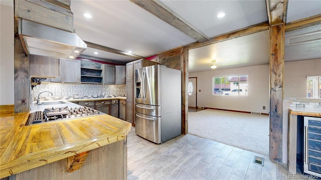 321 Stockton Ct, Gilcrest, CO 80623 - kitchen with stainless steel appliances, open shelves, wine cooler, decorative backsplash, and light countertops