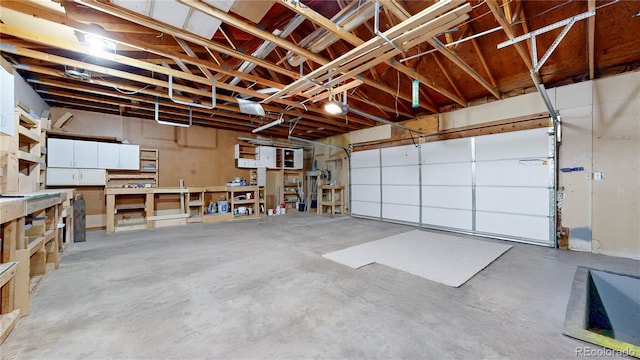 321 Stockton Ct, Gilcrest, CO 80623 - garage with a workshop area and a garage door opener