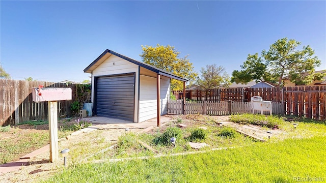 321 Stockton Ct, Gilcrest, CO 80623 - detached garage featuring fence and a storage unit