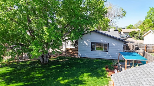 321 Stockton Ct, Gilcrest, CO 80623 - rear view of property with stairway