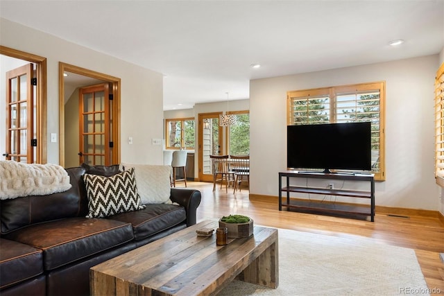 29962 Troutdale Ridge Rd, Evergreen, CO 80439 - living area featuring wood finished floors, recessed lighting, and baseboards