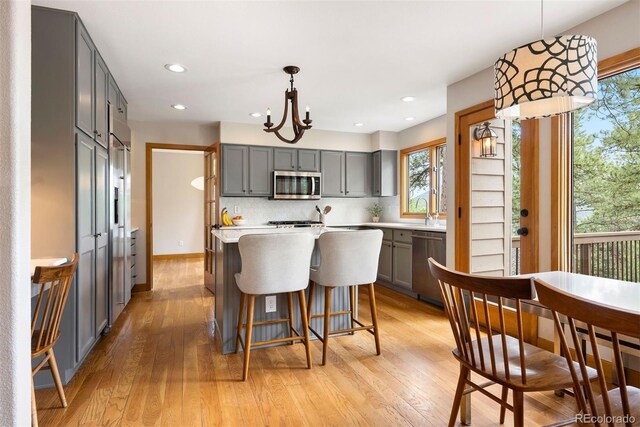29962 Troutdale Ridge Rd, Evergreen, CO 80439 - kitchen with appliances with stainless steel finishes, gray cabinets, healthy amount of natural light, and recessed lighting