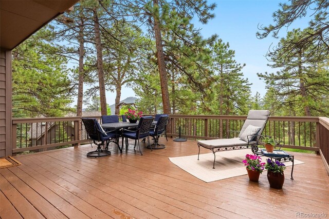 29962 Troutdale Ridge Rd, Evergreen, CO 80439 - wooden deck with outdoor dining space