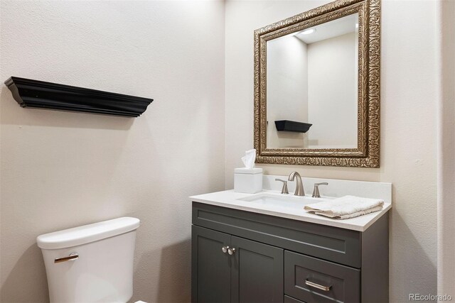 29962 Troutdale Ridge Rd, Evergreen, CO 80439 - half bath featuring toilet and vanity