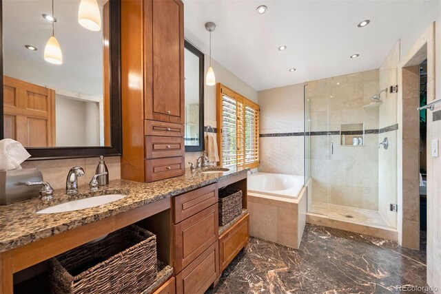 29962 Troutdale Ridge Rd, Evergreen, CO 80439 - full bathroom with a stall shower, a bath, double vanity, marble tiled floors, and recessed lighting