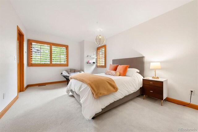 29962 Troutdale Ridge Rd, Evergreen, CO 80439 - bedroom featuring baseboards and light colored carpet