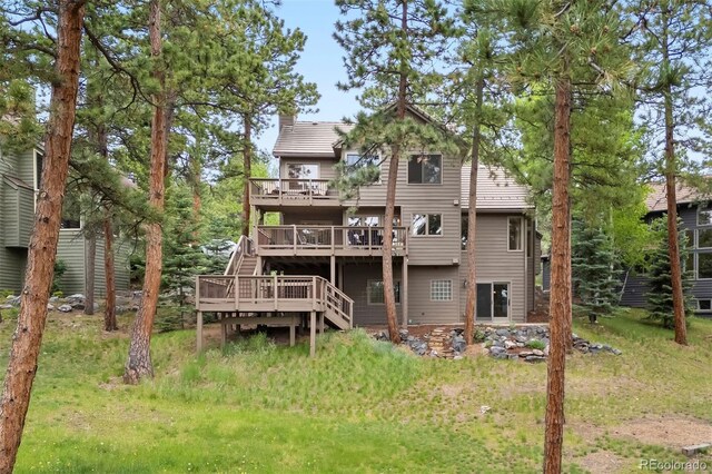 29962 Troutdale Ridge Rd, Evergreen, CO 80439 - back of house featuring a wooden deck and stairway
