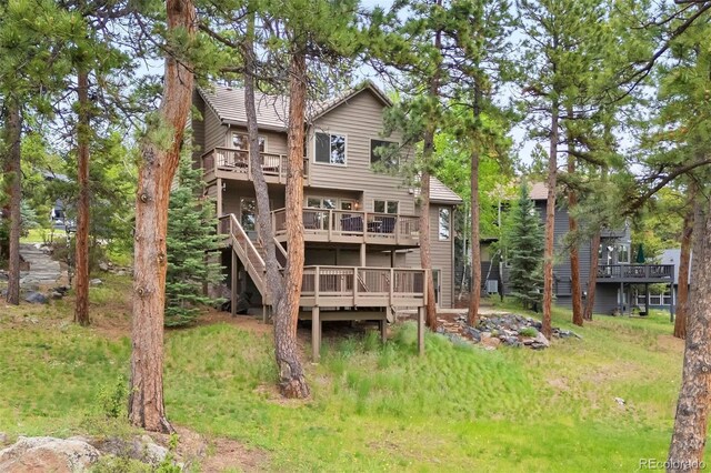 29962 Troutdale Ridge Rd, Evergreen, CO 80439 - rear view of house with a wooden deck