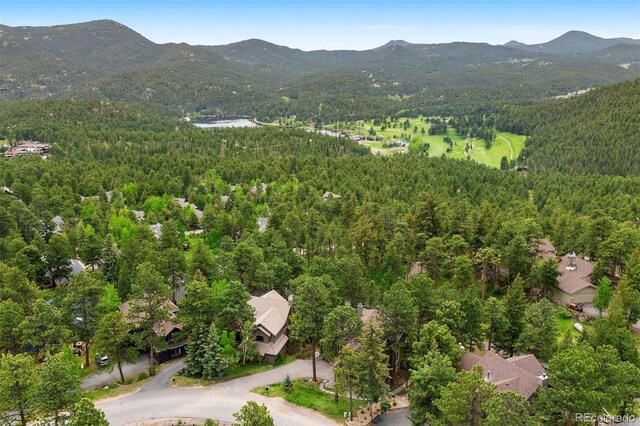 29962 Troutdale Ridge Rd, Evergreen, CO 80439 - aerial overview of property's location featuring a heavily wooded area and mountains