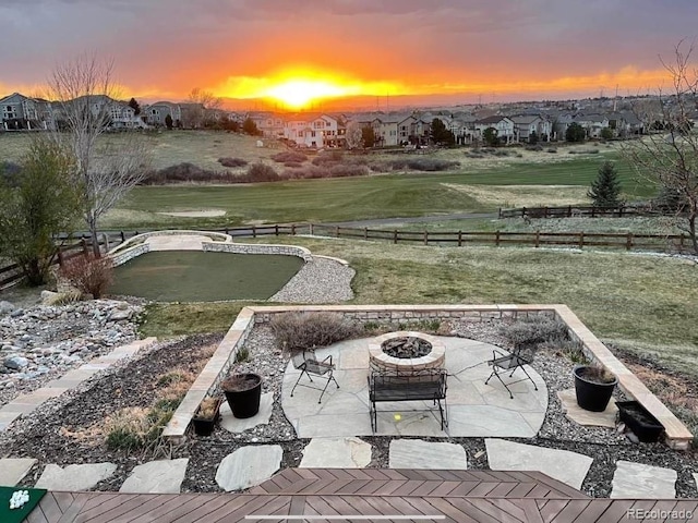 exterior space featuring a lawn and an outdoor fire pit