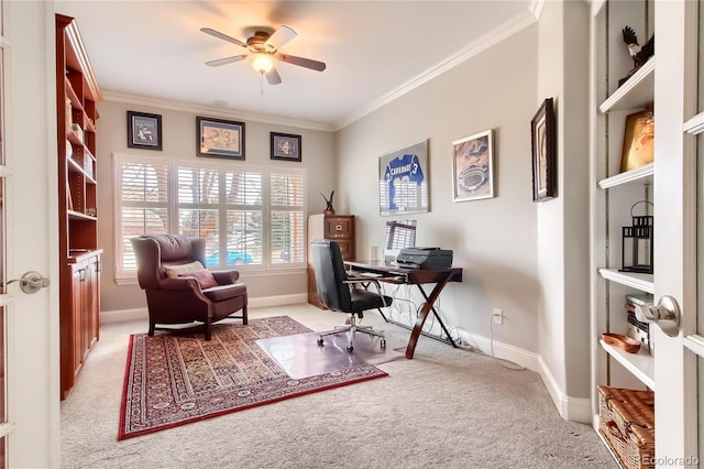 carpeted office featuring ornamental molding and ceiling fan