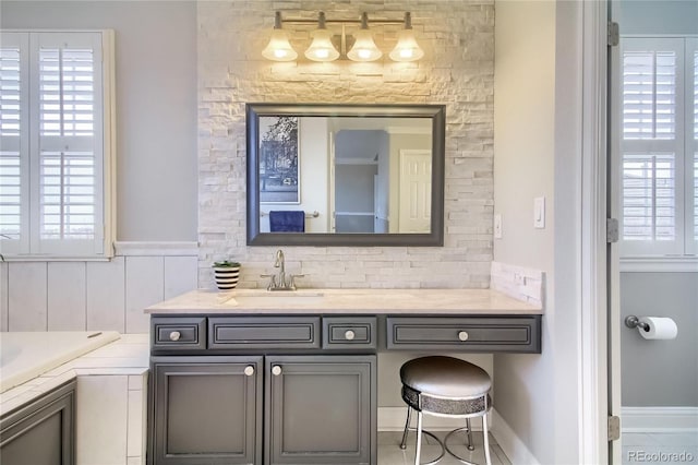 bathroom with vanity and backsplash