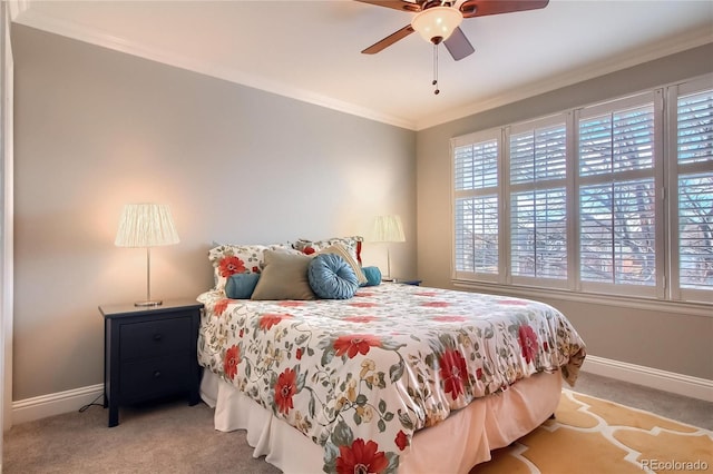 bedroom with crown molding, light colored carpet, and ceiling fan