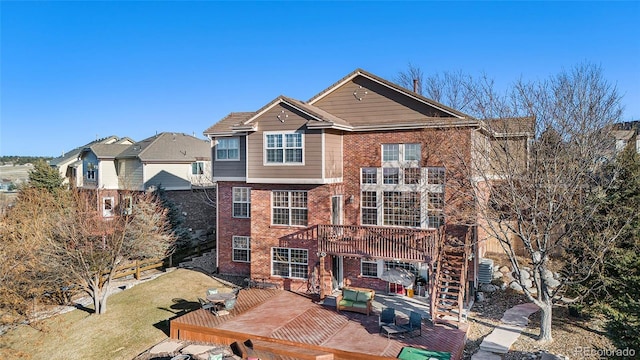 exterior space with a deck and a front yard