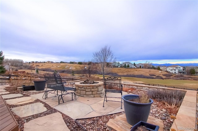 view of patio / terrace with an outdoor fire pit