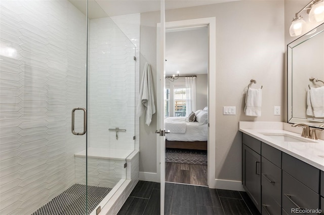 bathroom featuring vanity and an enclosed shower