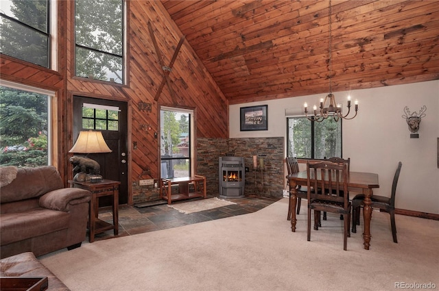 dining area with high vaulted ceiling, dark carpet, wooden ceiling, wood walls, and a notable chandelier