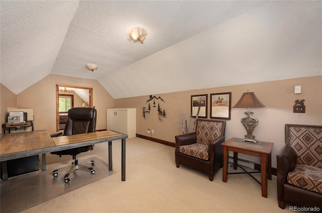 office with a textured ceiling, light colored carpet, baseboards, and vaulted ceiling