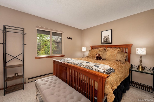 carpeted bedroom featuring a baseboard radiator, baseboards, and a textured ceiling