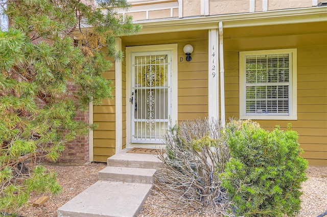 14129 E Dickinson Dr Unit D, Aurora, CO 80014 - doorway to property with a porch