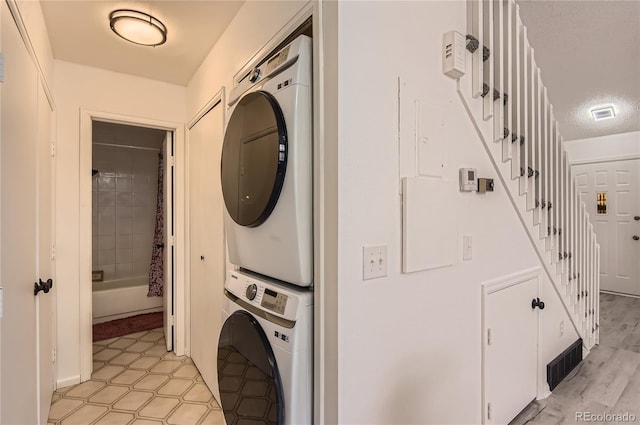 14129 E Dickinson Dr Unit D, Aurora, CO 80014 - washroom featuring stacked washer / drying machine