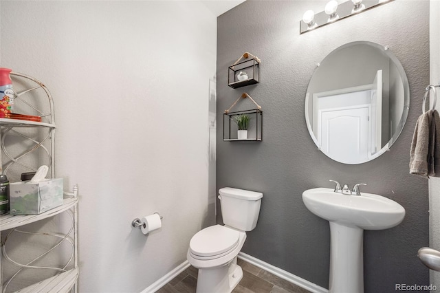 bathroom with sink and toilet