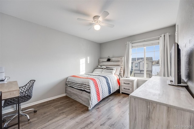 bedroom with dark wood-type flooring and ceiling fan