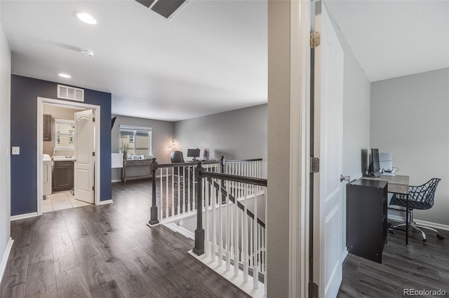 hall with washer / clothes dryer and hardwood / wood-style floors