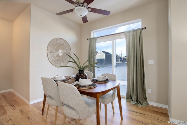 dining room featuring ceiling fan and light hardwood / wood-style flooring