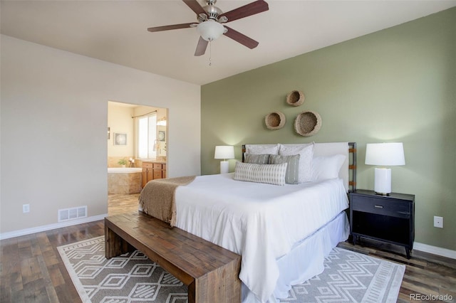 bedroom featuring dark hardwood / wood-style flooring, connected bathroom, and ceiling fan