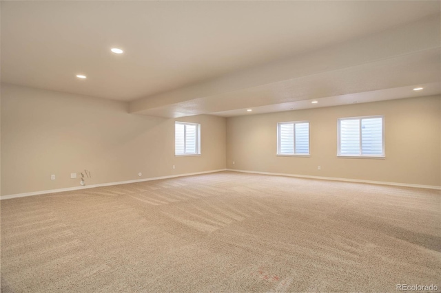 carpeted spare room with plenty of natural light