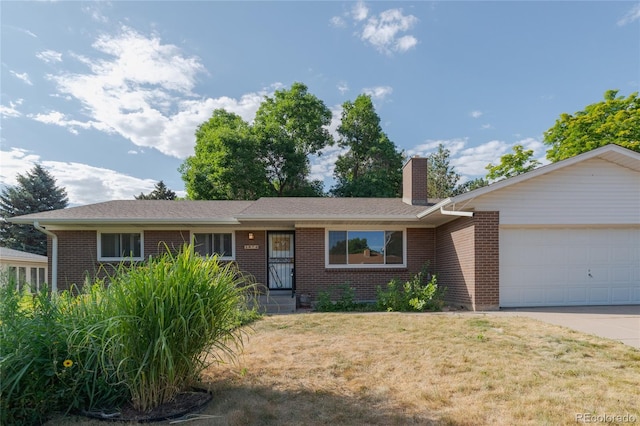 2976 S Magnolia Way, Denver, CO 80224 - single story home with brick siding, an attached garage, a front yard, and driveway