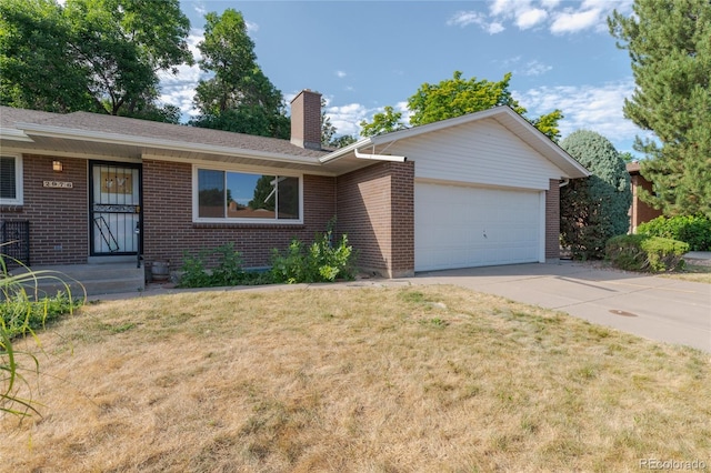2976 S Magnolia Way, Denver, CO 80224 - ranch-style house with brick siding, an attached garage, a chimney, concrete driveway, and a front lawn