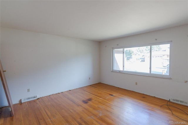 2976 S Magnolia Way, Denver, CO 80224 - spare room featuring light wood-style flooring