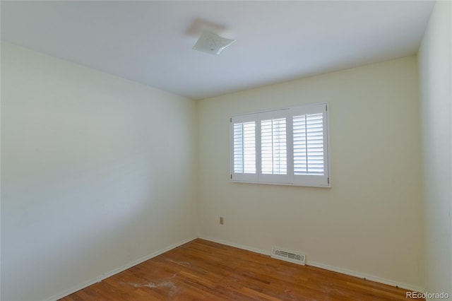 2976 S Magnolia Way, Denver, CO 80224 - spare room with wood finished floors and baseboards