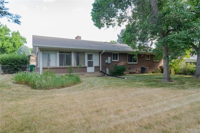 2976 S Magnolia Way, Denver, CO 80224 - ranch-style house featuring brick siding, a chimney, and a shingled roof
