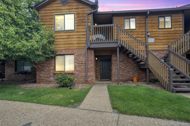 2237 S Buckley Rd Unit 101, Aurora, CO 80013 - view of front facade with stairway and brick siding