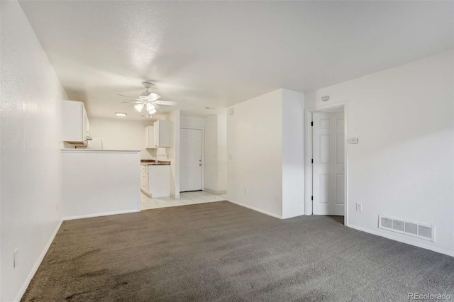 2237 S Buckley Rd Unit 101, Aurora, CO 80013 - unfurnished living room featuring light carpet and a ceiling fan