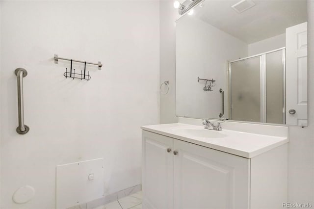 2237 S Buckley Rd Unit 101, Aurora, CO 80013 - full bath featuring vanity, a shower stall, and marble finish flooring